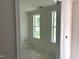 Well-lit bedroom shows two windows overlooking the yard, creating a calm and inviting space at 9152 Dupree Meadow Dr # 12, Angier, NC 27501