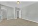 Bedroom with carpet flooring, neutral walls, two closets, and a bright white door at 9152 Dupree Meadow Dr # 12, Angier, NC 27501