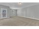 Bedroom with a door to the back deck, neutral carpet and light gray walls at 9152 Dupree Meadow Dr # 12, Angier, NC 27501