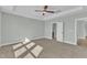 Bright bedroom features a ceiling fan and carpet at 9152 Dupree Meadow Dr # 12, Angier, NC 27501