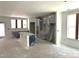 Unfinished kitchen with covered cabinets and center island with modern design at 9152 Dupree Meadow Dr # 12, Angier, NC 27501