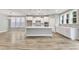 Spacious kitchen with white cabinets, a large center island, and stainless steel appliances at 9152 Dupree Meadow Dr # 12, Angier, NC 27501