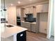 Beautiful kitchen features stainless steel appliances, gas cooktop, ample storage, and a large island at 9152 Dupree Meadow Dr # 12, Angier, NC 27501