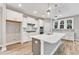 Modern kitchen featuring white cabinets, quartz countertops, stainless steel appliances, and a spacious island at 9152 Dupree Meadow Dr # 12, Angier, NC 27501