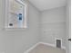 Bright laundry room with window, utility connections, and white walls at 9152 Dupree Meadow Dr # 12, Angier, NC 27501