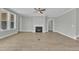 Bright living room with hardwood floors, fireplace, and a ceiling fan at 9152 Dupree Meadow Dr # 12, Angier, NC 27501