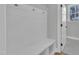 Mudroom with hooks, bench, storage cubbies, and a view to the backyard through the exterior door at 9152 Dupree Meadow Dr # 12, Angier, NC 27501