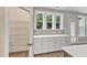 Walk-in pantry with custom shelving and white cabinets at 9152 Dupree Meadow Dr # 12, Angier, NC 27501
