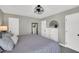 Calm bedroom features neutral colors, a dresser, a full-length mirror, and closet at 99 Stoney Hill Ln, Sanford, NC 27332