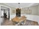 Elegant dining room features a wooden table, stylish chandelier, and decorative wall art at 99 Stoney Hill Ln, Sanford, NC 27332