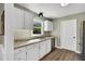Charming kitchen with white cabinets, granite countertops, and stainless steel appliances at 99 Stoney Hill Ln, Sanford, NC 27332