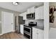 Well-equipped kitchen features stainless steel appliances, white cabinets, and granite counters at 99 Stoney Hill Ln, Sanford, NC 27332