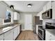 Bright kitchen features stainless steel appliances, ample cabinet space, and granite counters at 99 Stoney Hill Ln, Sanford, NC 27332
