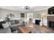 Well-lit living room showcasing an open layout, fireplace, and modern decor with seamless flow to other living spaces at 99 Stoney Hill Ln, Sanford, NC 27332