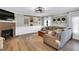 Cozy living room features a fireplace, modern decor, and wood-style flooring, perfect for relaxation and comfort at 99 Stoney Hill Ln, Sanford, NC 27332