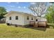 View of the home's backyard featuring a small wooden deck and easy access to the yard at 1001 Helms Pl, Raleigh, NC 27610