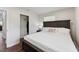 Bedroom featuring closet access, natural lighting, and hardwood floors at 1001 Helms Pl, Raleigh, NC 27610