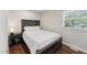 Bedroom with dark wood floors, neutral walls, and natural lighting at 1001 Helms Pl, Raleigh, NC 27610