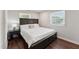 Bedroom with dark wood floors, natural lighting, and a modern design at 1001 Helms Pl, Raleigh, NC 27610