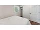 Bedroom featuring hardwood floors, natural lighting, and closet access at 1001 Helms Pl, Raleigh, NC 27610