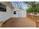 A backyard wood deck is featured with direct access to the house and backyard at 1001 Helms Pl, Raleigh, NC 27610