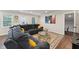 Inviting living room with a gray sectional sofa, patterned rug, and modern decor at 1001 Helms Pl, Raleigh, NC 27610