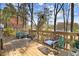 Relax on this spacious back deck surrounded by beautiful trees and enjoy the outdoors at 104 Amberhill Ct, Garner, NC 27529