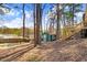 A private backyard features a tool shed, a deck, and a wooden fence, perfect for Gathering gatherings and outdoor activities at 104 Amberhill Ct, Garner, NC 27529