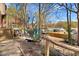 View of a well-maintained backyard with wooden fence, storage shed, and natural surroundings at 104 Amberhill Ct, Garner, NC 27529