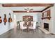 Inviting dining room featuring hardwood floors, a fireplace, and stylish décor creates a warm and welcoming ambiance at 104 Amberhill Ct, Garner, NC 27529
