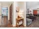 Inviting living room featuring dark-toned hardwood floors and neutral walls, creating a cozy yet stylish atmosphere at 104 Amberhill Ct, Garner, NC 27529