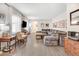 Bright and airy living room featuring hardwood floors, a plush sectional sofa, natural light, and vintage décor at 104 Amberhill Ct, Garner, NC 27529
