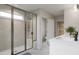 Modern bathroom features a tiled shower with a glass door, a toilet and vanity with a white countertop at 1065 Hardin Hill Ln, Knightdale, NC 27545