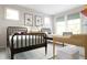 ' room featuring two twin beds, bright windows, and a desk with white and wood tones at 1065 Hardin Hill Ln, Knightdale, NC 27545