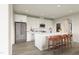 Kitchen features white cabinets, stainless steel appliances, and an island with bar seating at 1065 Hardin Hill Ln, Knightdale, NC 27545