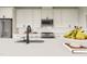 Modern kitchen with white cabinets, stainless steel appliances, quartz countertops, and black hardware at 1065 Hardin Hill Ln, Knightdale, NC 27545