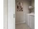Clean laundry room featuring a white washer and dryer with a shelf above at 1065 Hardin Hill Ln, Knightdale, NC 27545
