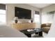 Bright living room featuring a large TV, modern furniture, and window with natural light at 1065 Hardin Hill Ln, Knightdale, NC 27545