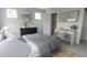 Comfortable main bedroom with a mirror, side table, dresser, and a neutral color scheme at 1065 Hardin Hill Ln, Knightdale, NC 27545