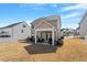 View of the backyard featuring a covered patio area with grilling area at 117 Highland Forest Dr, Fuquay Varina, NC 27526