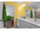 Bright bathroom features a double sink vanity with quartz countertops at 117 Highland Forest Dr, Fuquay Varina, NC 27526