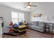 Bedroom featuring wood floors, a ceiling fan, and natural light at 117 Highland Forest Dr, Fuquay Varina, NC 27526
