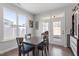 Dining room featuring a wooden table, and four chairs with natural light and outdoor access at 117 Highland Forest Dr, Fuquay Varina, NC 27526