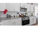 Well-appointed kitchen with granite countertops and modern stainless steel appliances at 117 Highland Forest Dr, Fuquay Varina, NC 27526