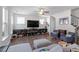 Bright and airy living room featuring hardwood floors, natural light, and backyard views at 117 Highland Forest Dr, Fuquay Varina, NC 27526