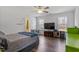 Bedroom boasts natural light, ceiling fan, and wood-look flooring at 117 Highland Forest Dr, Fuquay Varina, NC 27526