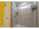 Glass enclosed shower with tiled surround and showerhead at 117 Highland Forest Dr, Fuquay Varina, NC 27526