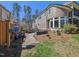 The backyard stone path leads past the raised garden beds and up to the house at 119 November Dr, Durham, NC 27712