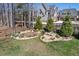 The backyard is fully fenced and has decorative garden areas at 119 November Dr, Durham, NC 27712