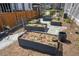 This backyard features raised garden beds, mature landscaping, and manicured mulch at 119 November Dr, Durham, NC 27712